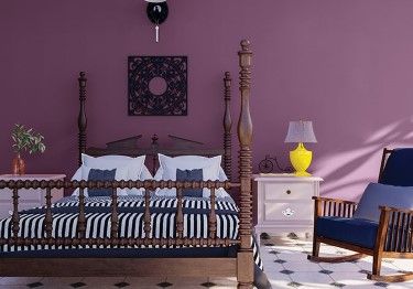 Rustic Bedroom with Deep Purple Wall